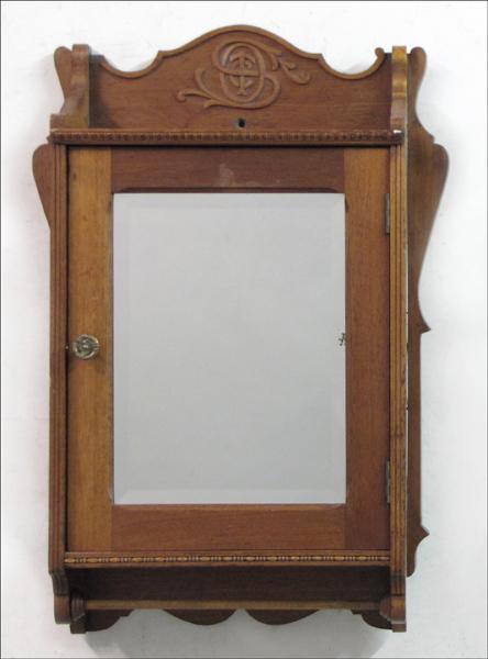 VICTORIAN STYLE CARVED WALNUT SHAVING CABINET.: VICTORIAN STYLE CARVED WALNUT SHAVING CABINET. H: 32" W: 23" D: 8"