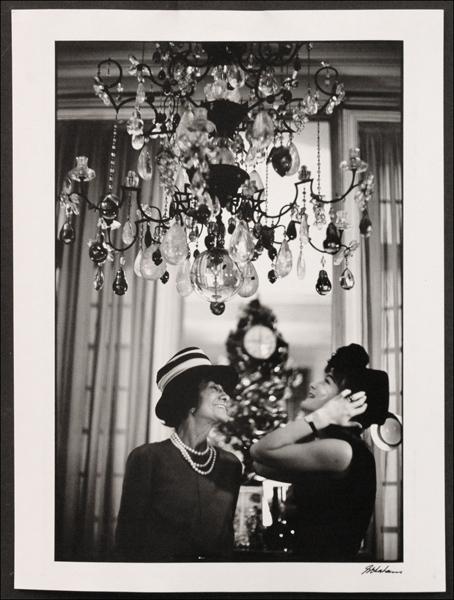 SHAHROKH HATAMI (B. 1928) ROMY SCHNEIDER AND CO: SHAHROKH HATAMI (B. 1928) ROMY SCHNEIDER AND COCO CHANNEL. Gelatin silver print, signed in ink lower right; Titled, signed and dated 1965 on the reverse; Loose sheet 16" x 12" (sheet)