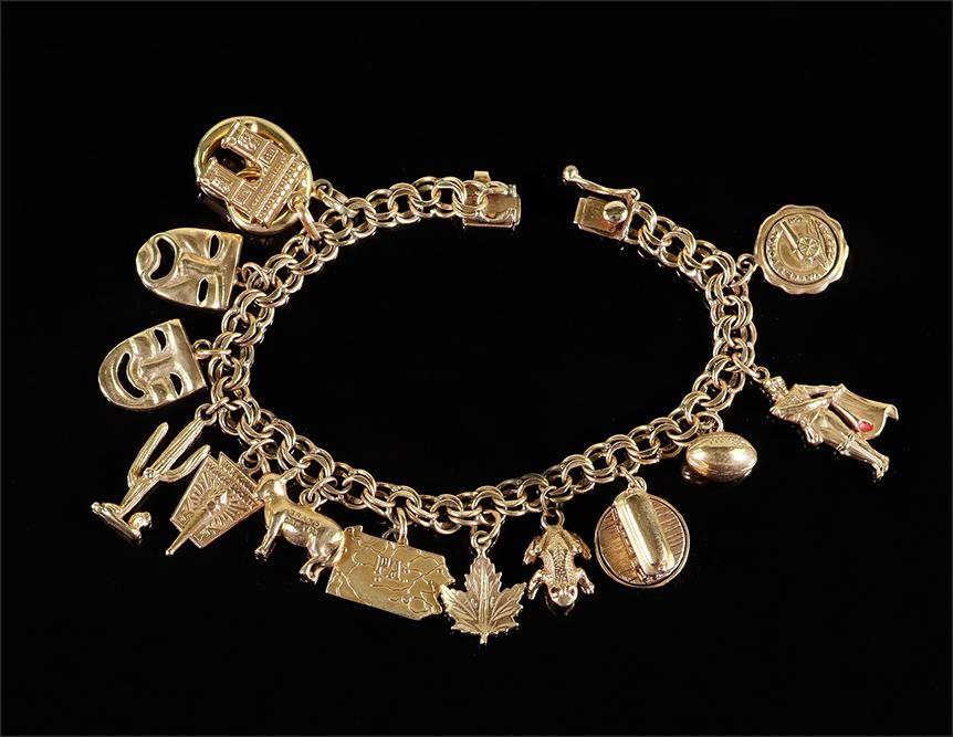 A Yellow Gold Charm Bracelet. (1 of 1)