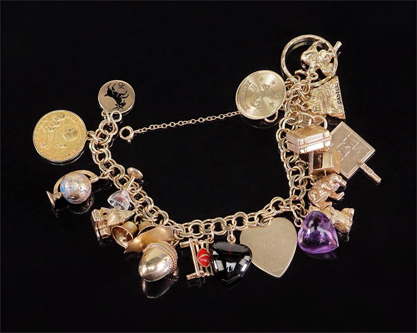 A Yellow Gold Charm Bracelet. (1 of 1)