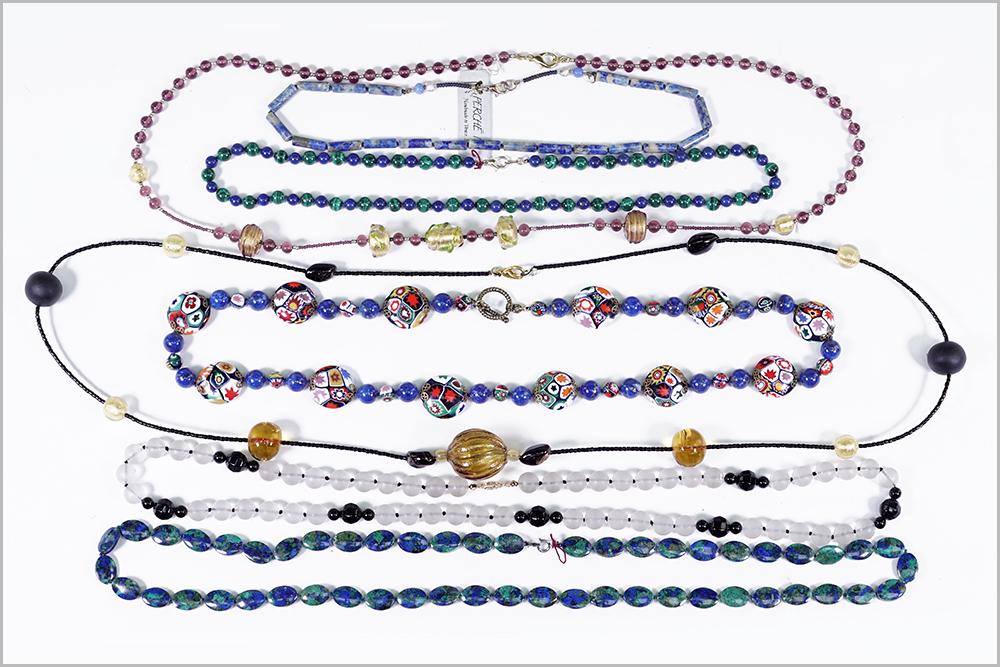 A Collection of Necklaces.: A Collection of Necklaces. Comprising a frosted rock crystal bead and onyx necklace with a 14 karat yellow gold clasp, an azurite malachite bead necklace, a lapis and malachite bead necklace, a lapis