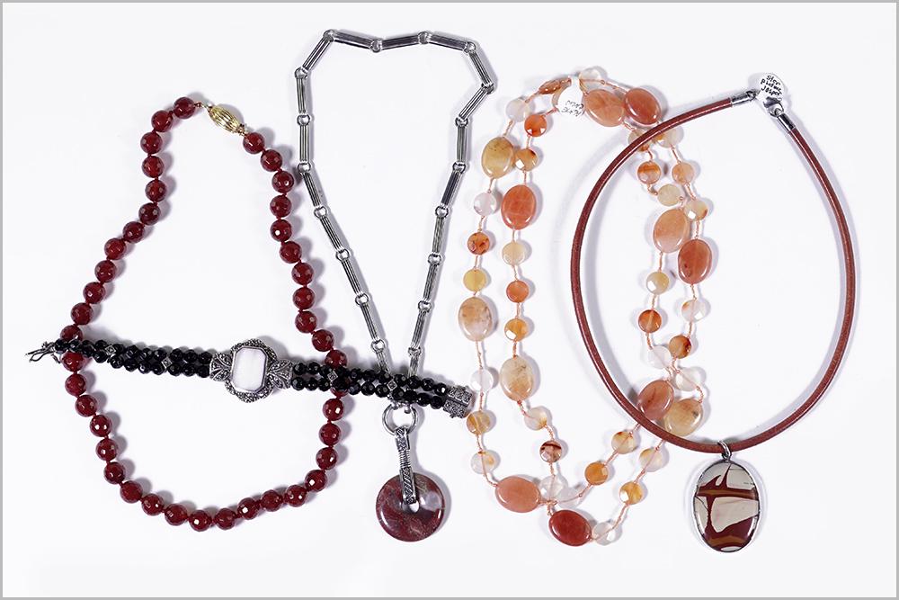 A Sterling Silver and Jasper Necklace.: A Sterling Silver and Jasper Necklace. Together with a jasper and sterling silver pendant with leather cord necklace, a faceted onyx and sterling silver bracelet, a faceted carnelian bead necklace and
