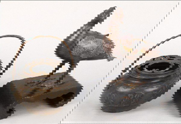 CHINESE CHAMPLEVE ENAMEL BIRD ON STAND.: CHINESE CHAMPLEVE ENAMEL BIRD ON STAND. Together with a Chinese brass incense burner Bird on stand: 12" x 9/5"