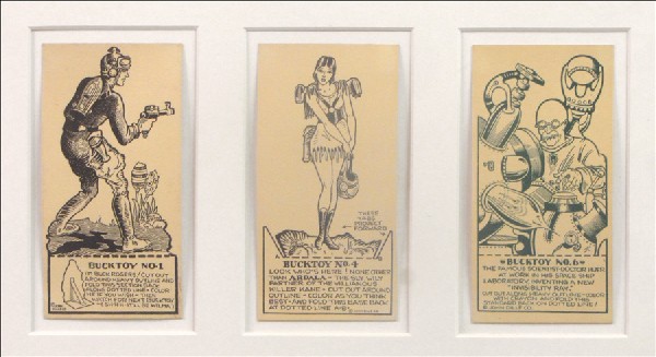 THREE BUCK ROGERS CUT-OUT PAPER FIGURES.: THREE BUCK ROGERS CUT-OUT PAPER FIGURES. All three are uncut and not bent. Comprised of #1 Buck Rogers, #4 Ardala, and #6 Dr. Huer. Framed and matted under plexiglass Frame: 14.5" x 18"