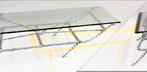 HOLLY HUNT GILT METAL AND GLASS COFFEE TABLE.: HOLLY HUNT GILT METAL AND GLASS COFFEE TABLE. H: 18.25" W: 64" D: 42"