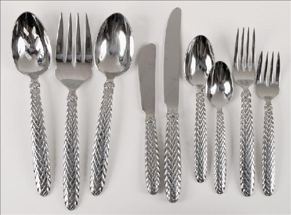 RALPH LAUREN STAINLESS STEEL FLATWARE IN THE EQ: RALPH LAUREN STAINLESS STEEL FLATWARE IN THE EQUESTRIAN BRAID PATTERN. Comprised of ten dinner forks, ten salad forks, fourteen teaspoons, eight tablespoons, ten dinner knives, two serving forks, two 