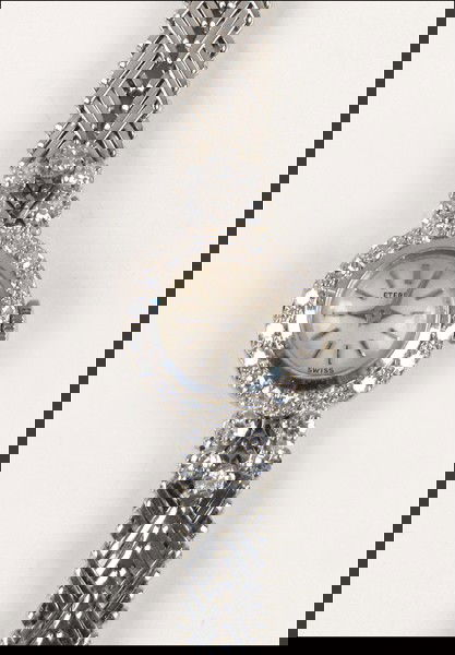 ETERNA 18 KARAT WHITE GOLD AND DIAMOND WATCH.: ETERNA 18 KARAT WHITE GOLD AND DIAMOND WATCH. 28 single cut diamonds are F color, VS-1 clarity, and total approximately .66 carat Length: 7"