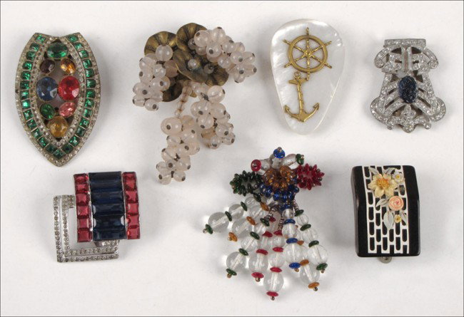 RALPH DEROSA BLUE, WHITE, AND RED RHINESTONE DR: RALPH DEROSA BLUE, WHITE, AND RED RHINESTONE DRESS CLIP. Together with an art deco white rhinestone and faux sapphire dress clip, a multicolored rhinestone dress clip, a nautical mother of pearl dress
