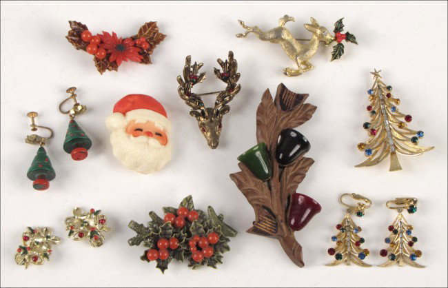 BROOKS MULTICOLORED RHINESTONE CHRISTMAS TREE B: BROOKS MULTICOLORED RHINESTONE CHRISTMAS TREE BROOCH AND EARCLIPS. Together with a Hattie Carnegie Christmas brooch, and other Christmas themed costume jewelry