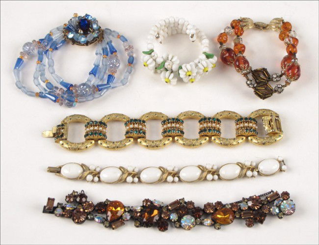 ORIGINAL BY ROBERT BROWN AND MULTICOLORED RHINE: ORIGINAL BY ROBERT BROWN AND MULTICOLORED RHINESTONE BRACELET. Together with a Trifari white bead bracelet, a Vendome rhinestone and bugle bead bracelet, an unsigned blue glass bead bracelet, a green