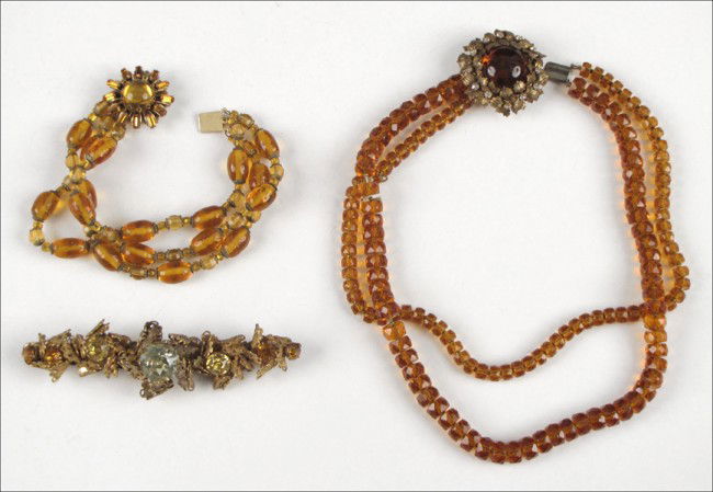 MIRIAM HASKELL FACETED AMBER GLASS TWO STRAND N: MIRIAM HASKELL FACETED AMBER GLASS TWO STRAND NECKLACE. Together with a Miriam Haskell green, orange, and amber rhinestone brooch, and a Miriam Haskell amber bead three strand bracelet