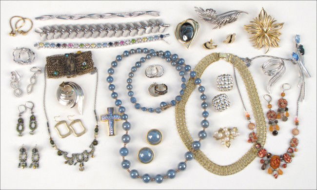 COLLECTION OF SIGNED COSTUME JEWELRY.: COLLECTION OF SIGNED COSTUME JEWELRY. With pieces by Givenchy, Trifari, Monet, Kramer, Swarovski, and Nolan Miller