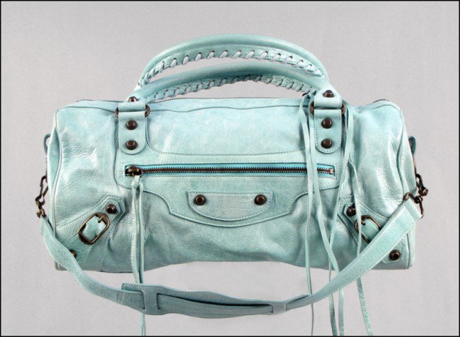 BALENCIAGA LIGHT BLUE LEATHER HANDBAG.: BALENCIAGA LIGHT BLUE LEATHER HANDBAG. Wit interior matching mirror, and tags H: 7" W: 15" D: 6"