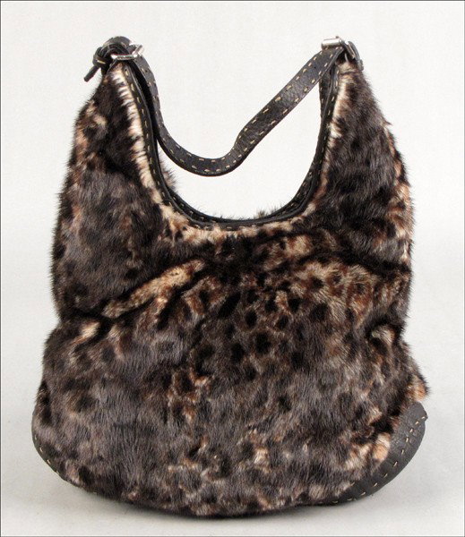 FENDI FUR AND LEATHER HANDBAG.: FENDI FUR AND LEATHER HANDBAG. In an animal print. With Fendi dustbag H: 15" W: 13" D: 6"