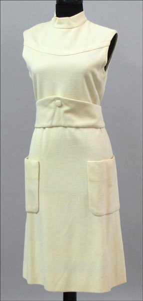 NORMAN NORELL CREAM WOOL DAY DRESS.: NORMAN NORELL CREAM WOOL DAY DRESS. With a cumberbund style self belt. Norell label has been removed