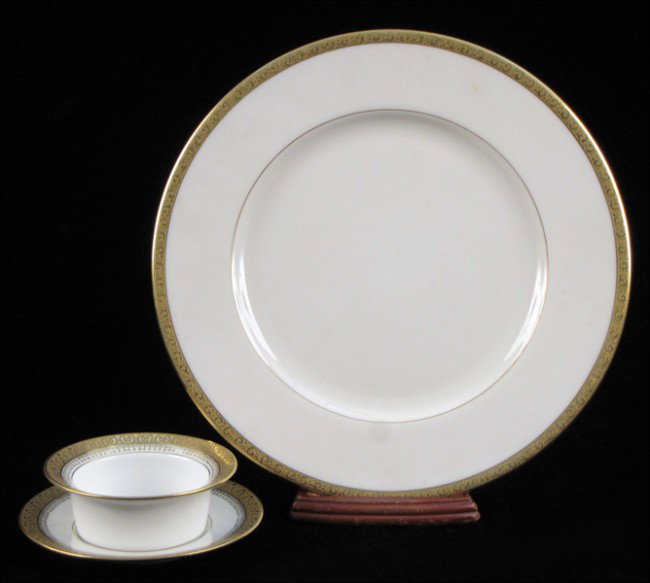 SET OF TWELVE LENOX FOR MARSHALL FIELD & COMPAN: SET OF TWELVE LENOX FOR MARSHALL FIELD & COMPANY GILT PORCELAIN DINNER PLATES. Together with a set of eleven Limoges for Marshall Field & Company gilt porcelain cups with saucers