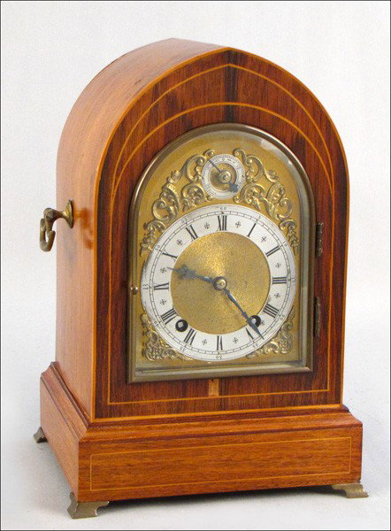 WINTERHALDER & HOFMEIER GERMAN INLAID MAHOGANY : WINTERHALDER & HOFMEIER GERMAN INLAID MAHOGANY MANTLE CLOCK. With key and pendulum H: 13" W: 8.5" D: 7"
