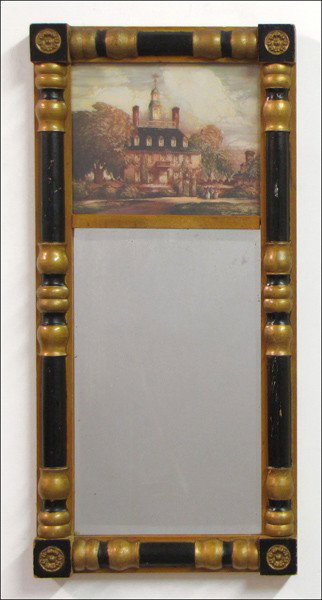 CARVED, GILT, AND EBONIZED WOOD TRUMEAU MIRROR.: CARVED, GILT, AND EBONIZED WOOD TRUMEAU MIRROR. With a decorative print above 29" x 14"
