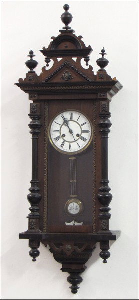 JUNGENS GERMAN CARVED AND EBONIZED WOOD REGULAT: JUNGENS GERMAN CARVED AND EBONIZED WOOD REGULATOR CLOCK. With key and pendulum H: 45" W: 16" D: 8"