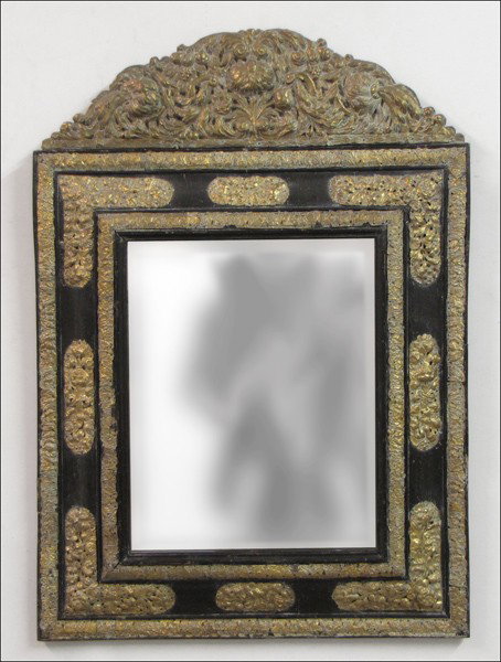 19TH CENTURY REPOUSSE BRASS AND EBONIZED WOOD M: 19TH CENTURY REPOUSSE BRASS AND EBONIZED WOOD MIRROR. 32.5" x 23"
