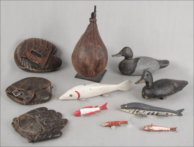 TWO DUCK DECOYS.: TWO DUCK DECOYS. Together with three leather baseball gloves, one leather punching bag, and fishing lures
