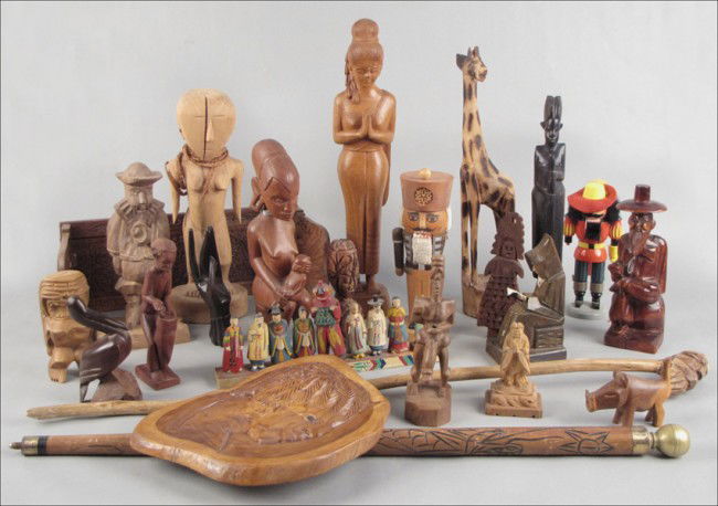 COLLECTION OF ASSORTED CARVED WOOD FIGURES.: COLLECTION OF ASSORTED CARVED WOOD FIGURES. Together with a carved wood cane, 37", and pool cue, 32.5" Tallest Figure: 20"