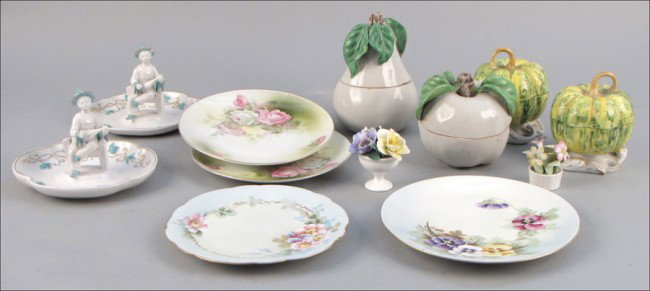 GROUP OF PORCELAIN AND CERAMIC DECORATIVE ITEMS: GROUP OF PORCELAIN AND CERAMIC DECORATIVE ITEMS. Including Limoges plates, Italian ceramic covered boxes, and English porcelan floral groups