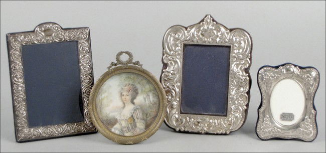 THREE STERLING SILVER PICTURE FRAMES.: THREE STERLING SILVER PICTURE FRAMES. Together with a 20th century oil on cardboard depicting a maiden, signed "Presly" LR