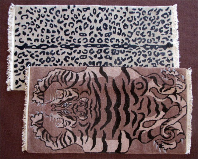 TWO ANIMAL PRINT RUGS.