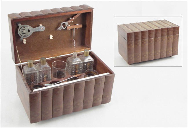 MAHOGANY BOOK FORM BAR.: MAHOGANY BOOK FORM BAR. Interior contains decanters, glasses, and bar tools