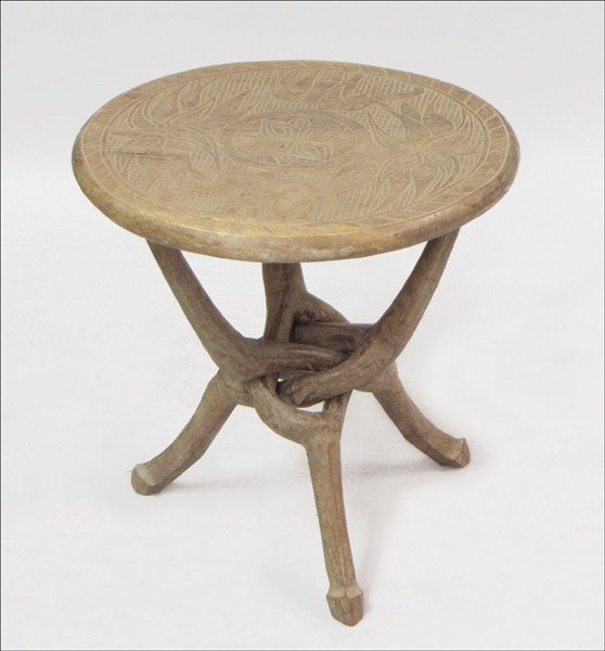 AFRICAN CARVED WOOD FOLDING SIDE TABLE.: AFRICAN CARVED WOOD FOLDING SIDE TABLE. With removeable top Height: 17.25" Diameter: 17"