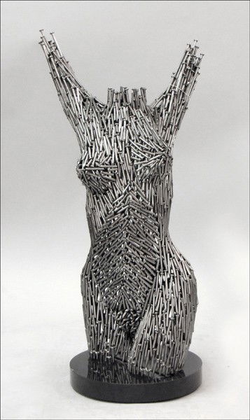 NISO MAMAN (ISRAELI, B. 1957) UNTITLED - TORSO.: NISO MAMAN (ISRAELI, B. 1957) UNTITLED - TORSO. Welded nails, stamped at the lower edge 'Niso 2000' and raised on a circular wood base Height: 38.50"