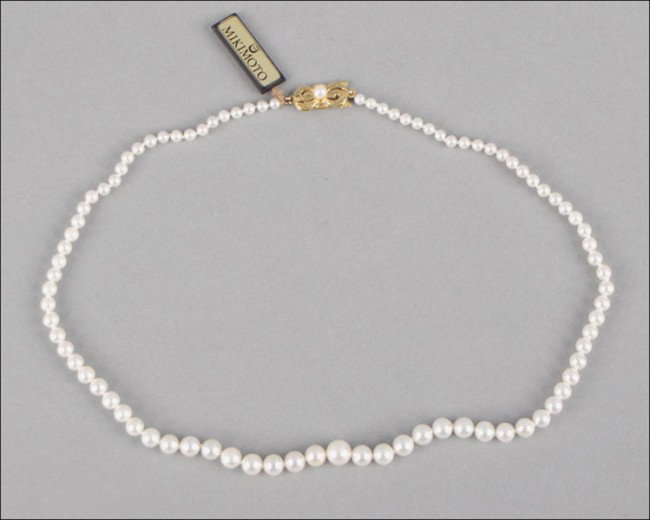 MIKIMOTO GRADUATED PEARL NECKLACE.: MIKIMOTO GRADUATED PEARL NECKLACE. Pearls range from 3mm to 7mm. With an 18 karat yellow gold clasp. With Mikimoto certificate Length: 16.5"