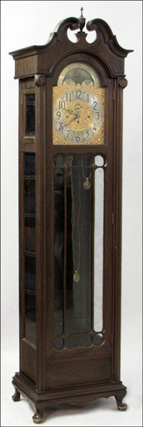 COLONIAL MANUFACTURING COMPANY MAHOGANY TALL CA: COLONIAL MANUFACTURING COMPANY MAHOGANY TALL CASE CLOCK. With three weights, five chimes, pendulum, and key H: 91" W: 24" D: 17"