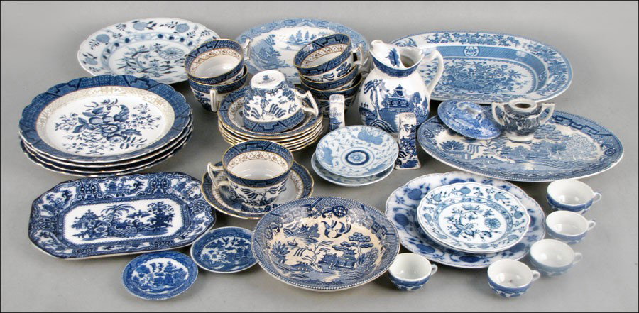 COLLECTION OF BLUE AND WHITE PORCELAIN.: COLLECTION OF BLUE AND WHITE PORCELAIN. Comprised of flow blue, blue willow, and blue onion teacups, plates, platters, and serving pieces