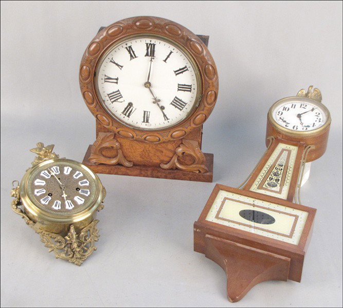 GROUP OF THREE CLOCKS.: GROUP OF THREE CLOCKS. Comprised of one banjo clock, one gilt metal clock, and one carved walnut mantle clock