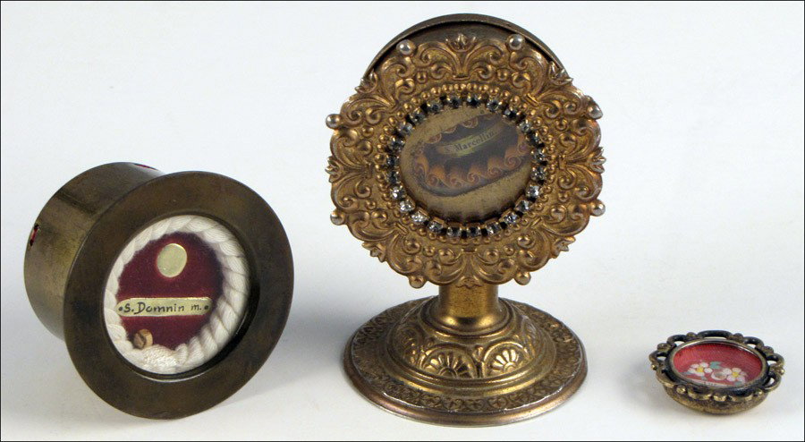 GROUP OF THREE PATINATED METAL RELIQUARY.: GROUP OF THREE PATINATED METAL RELIQUARY. Containing relics listed as St. Domnin, St. Anthony and St. Marcellin