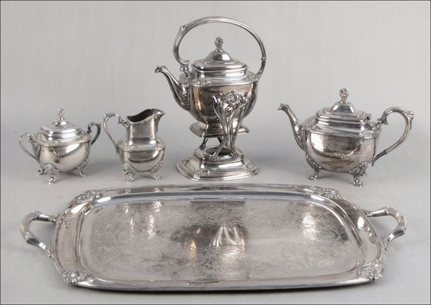 ROGERS BROTHERS SILVERPLATE TEA SERVICE IN THE: ROGERS BROTHERS SILVERPLATE TEA SERVICE IN THE DAFFODIL PATTERN. Comprised of a hot water kettle on stand, teapot, creamer, covered sugar bowl, and tray