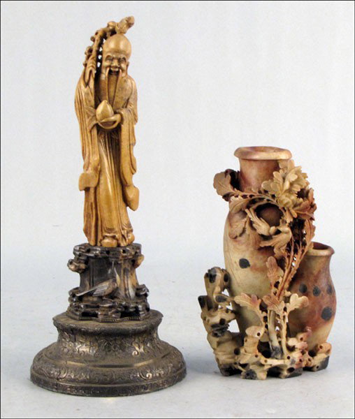 CHINESE CARVED SOAPSTONE FIGURE.: CHINESE CARVED SOAPSTONE FIGURE. Raised on a 2.75" metal lamp base. Together with a carved soapstone vase Figure: 9" Vase: 12"