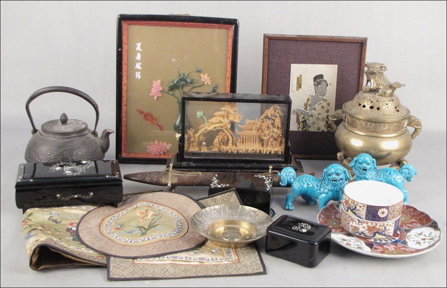 GROUP OF ASIAN DECORATIVE ITEMS.: GROUP OF ASIAN DECORATIVE ITEMS. Comprised of one cork carving, one brass censor, one metal teapot, lacquered boxes, one pair of foo dogs, one porcelain plate, and various table articles