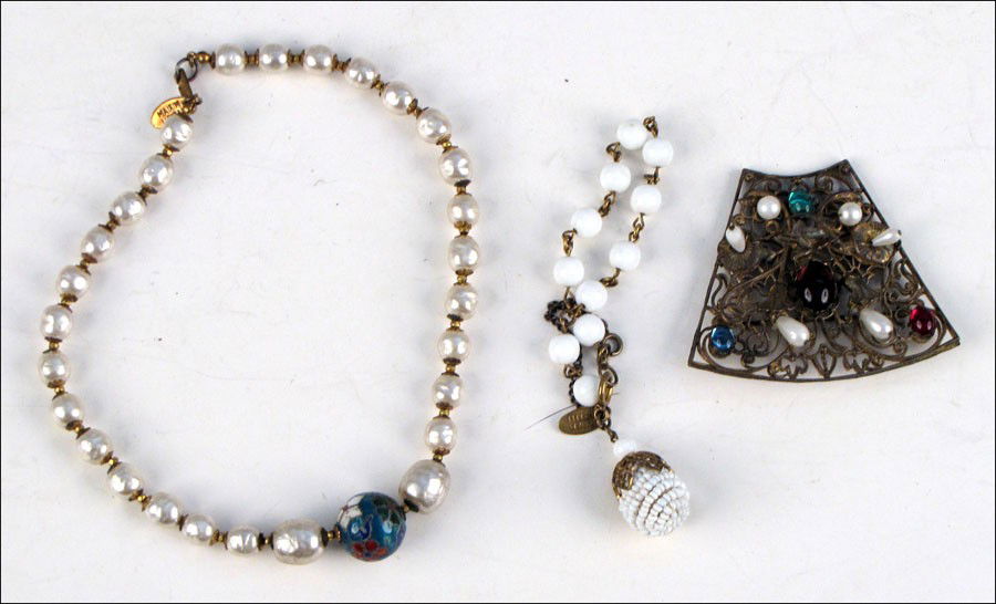 MIRIAM HASKELL GLASS AND FAUX PEARL BROOCH.: MIRIAM HASKELL GLASS AND FAUX PEARL BROOCH. Together with a Miriam Haskell white bead charm bracelet, and a Miriam Haskell faux baroque pearl necklace with a cloisonne bead center