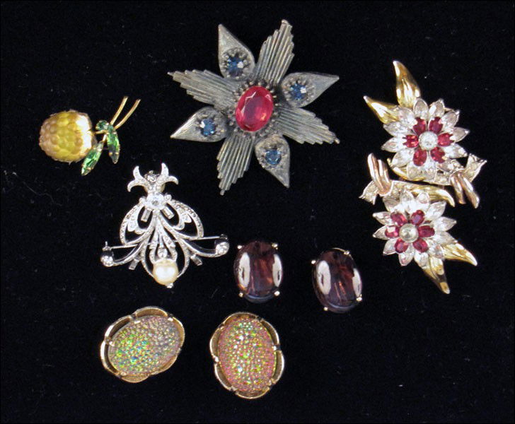 CORO RED AND WHITE RHINESTONE DUETTE BROOCH.: CORO RED AND WHITE RHINESTONE DUETTE BROOCH. Together with a Hattie Carnegie badge brooch, a Reja faux pearl and rhinestone brooch, an Austrian rasberry brooch, a pair of Schiaparelli purple earclips,