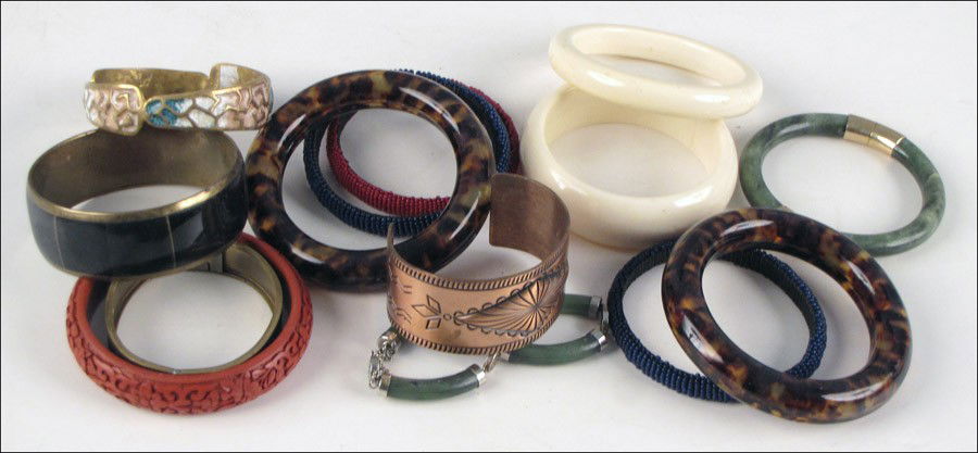 TWO CHINESE GREEN QUARTZ BRACELETS.: TWO CHINESE GREEN QUARTZ BRACELETS. Together with a faux cinnabar bracelet, two faux tortoise shell bracelets, three beaded bracelets, two faux ivory bracelets, and three bangles