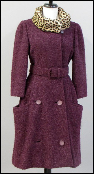 BLUM'S VOQUE PURPLE WOOL COAT.: BLUM'S VOQUE PURPLE WOOL COAT. With a self belt, 3/4 length sleeves, and leopard collar