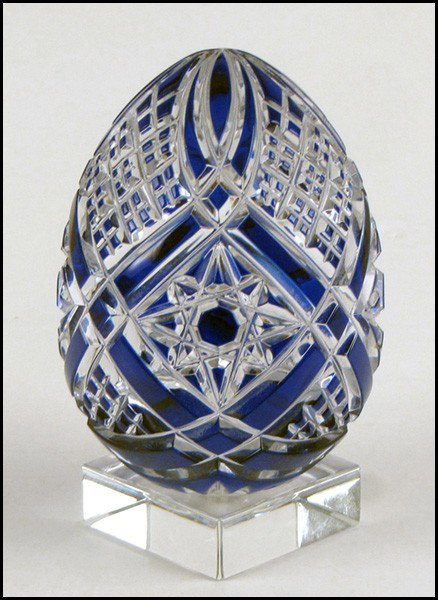 BACCARAT COBALT CUT-TO-CLEAR CRYSTAL EGG.: BACCARAT COBALT CUT-TO-CLEAR CRYSTAL EGG. With a Baccarat crystal stand Egg height: 4"
