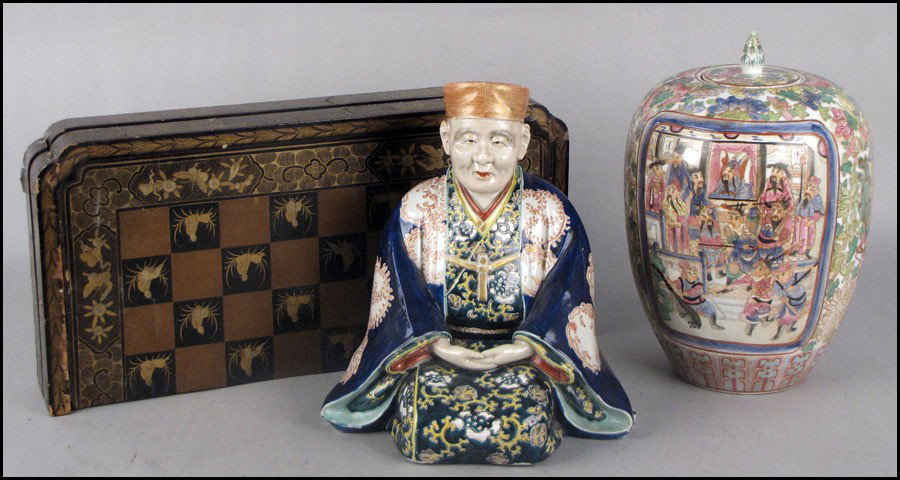 JAPANESE PORCELAIN SEATED FIGURE.: JAPANESE PORCELAIN SEATED FIGURE. Together with a painted porcelain covered urn, and a Japanese gilt papier mache game board Seated figure: 12"