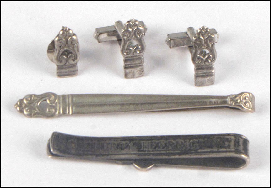 GEORG JENSEN STERLING SILVER TIE BAR.: GEORG JENSEN STERLING SILVER TIE BAR. Reverese is engraved "Cherry Heering". Together with an International sterling silver tie bar, shirt stud, and pair of cufflinks in the Royal Danish pattern