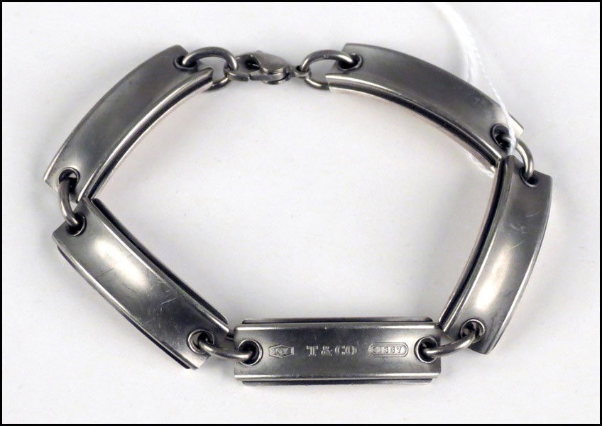 TIFFANY & COMPANY STERLING SILVER AND TITANIUM: TIFFANY & COMPANY STERLING SILVER AND TITANIUM LINK 1837 BRACELET. With Tiffany & Co pouch Length: 8.5"