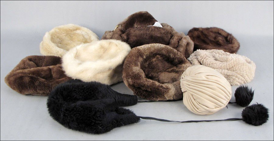 GROUP OF FUR ACCESSORIES.: GROUP OF FUR ACCESSORIES. Comprised of two mink hats, three beaver hats, one rabbit hat, a lamb skin hat, and a nutria handbag