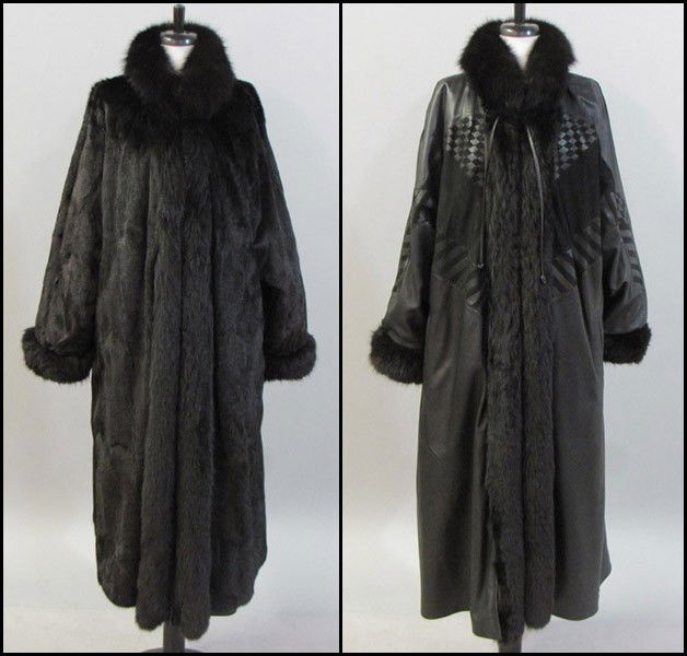 BLACK REVERSIBLE MINK COAT.: BLACK REVERSIBLE MINK COAT. With fox trim at the cuffs and collar, and a removable leather lining